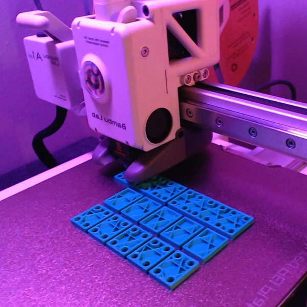 A bunch of bricks I designed to figure out heat set insert mechanics.